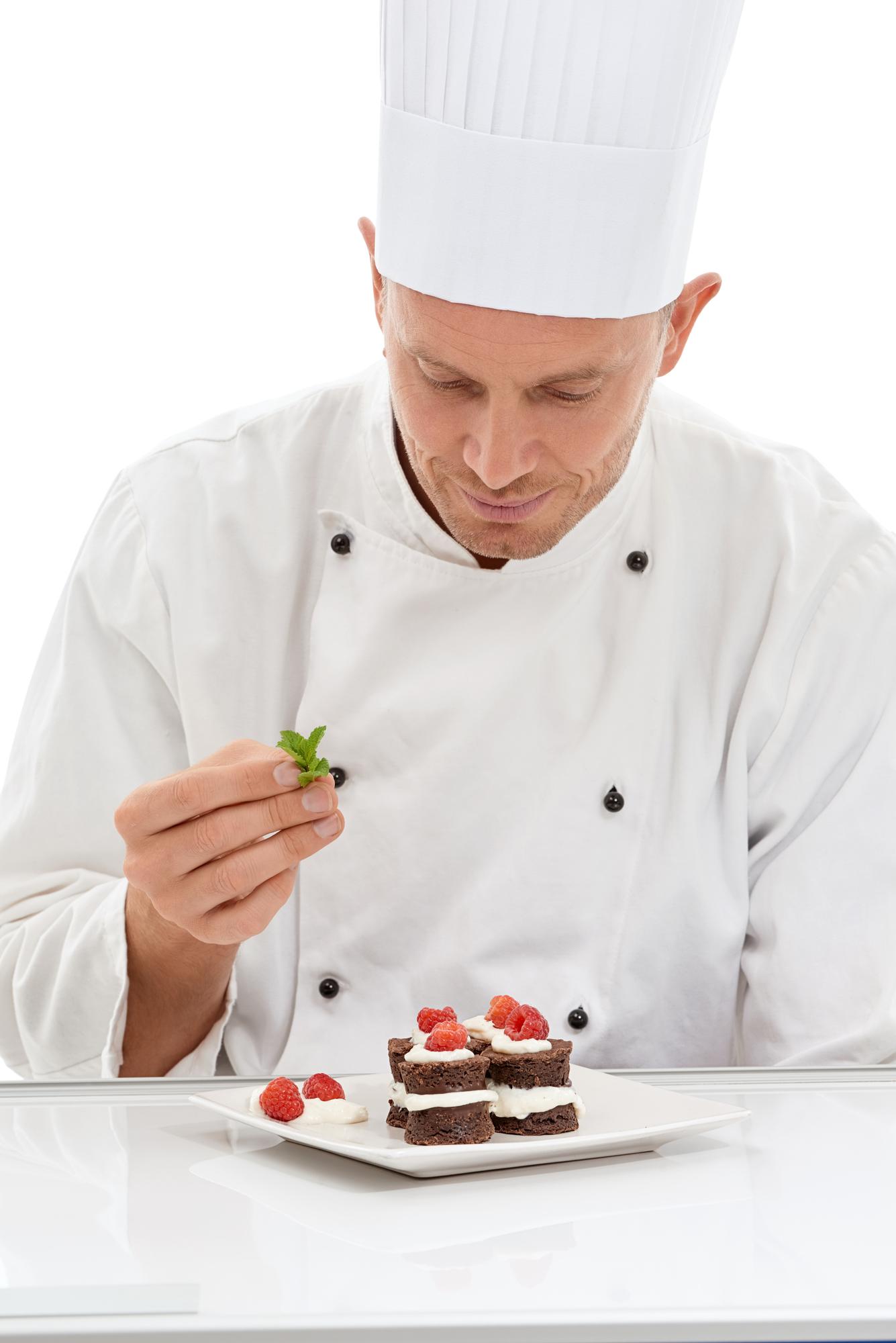 chef plating dessert with precision
